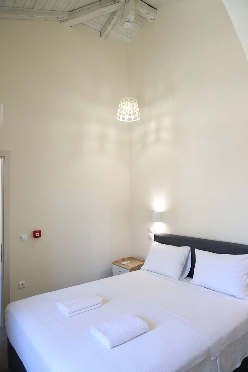 Bedroom with large double bed at Xenion 1850 in Chios