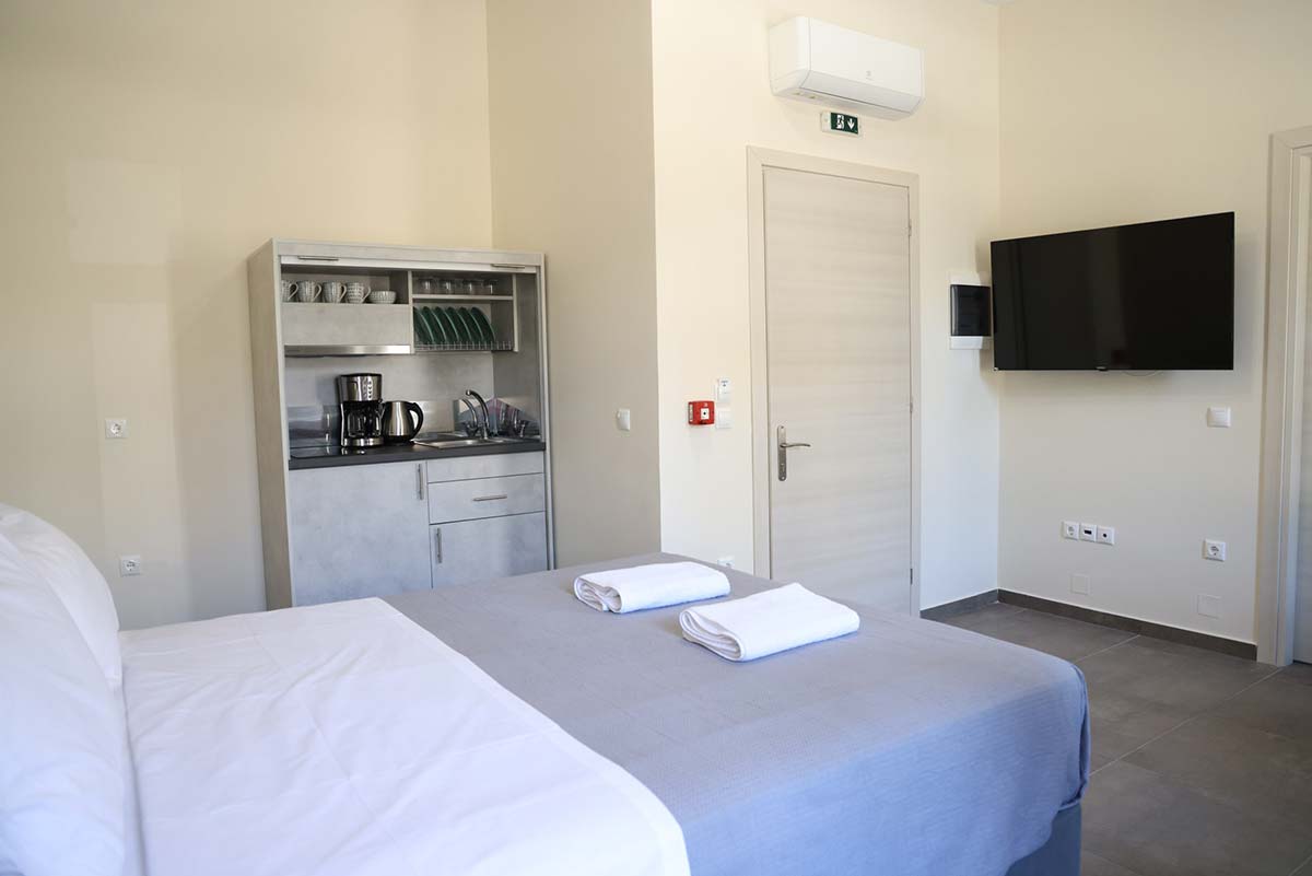 Bedroom with large double bed at Xenion 1850 in Chios