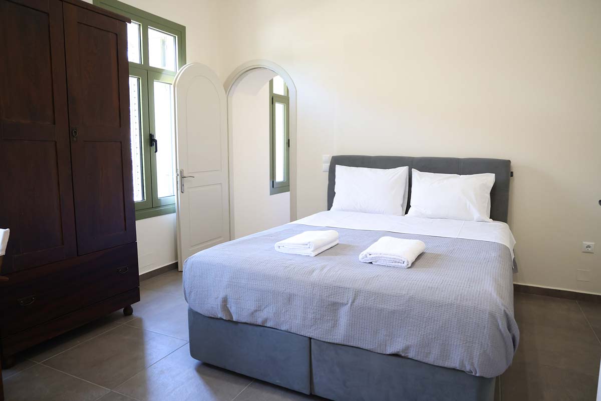 Bedroom with large double bed at Xenion 1850 in Chios