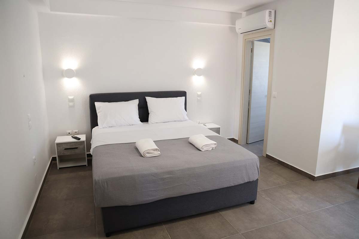 Bedroom with large double bed at Xenion 1850 in Chios